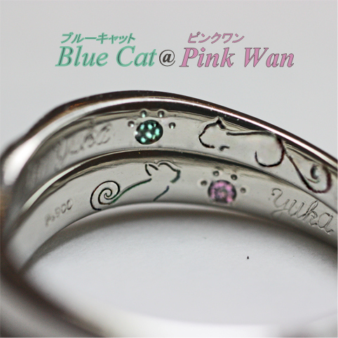 リングの内側にネコの模様と誕生石が入った結婚指輪