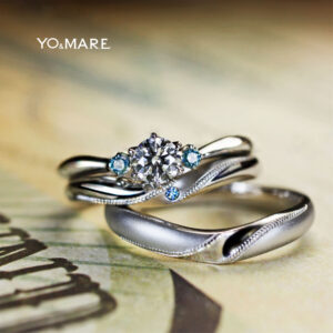 ブルーダイヤの婚約指輪とミルグレインの結婚指輪がセットされた作品